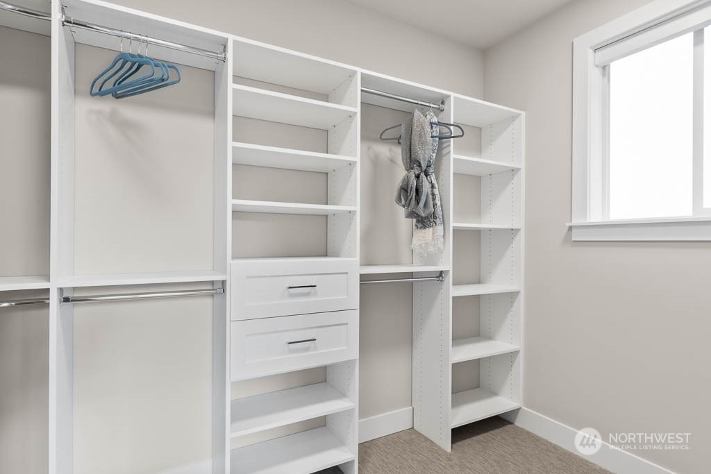 933 131st Place Northeast, Unit 4 Bellevue, WA 98005 - Photo 16 of 18 a view of walk in closet with empty racks