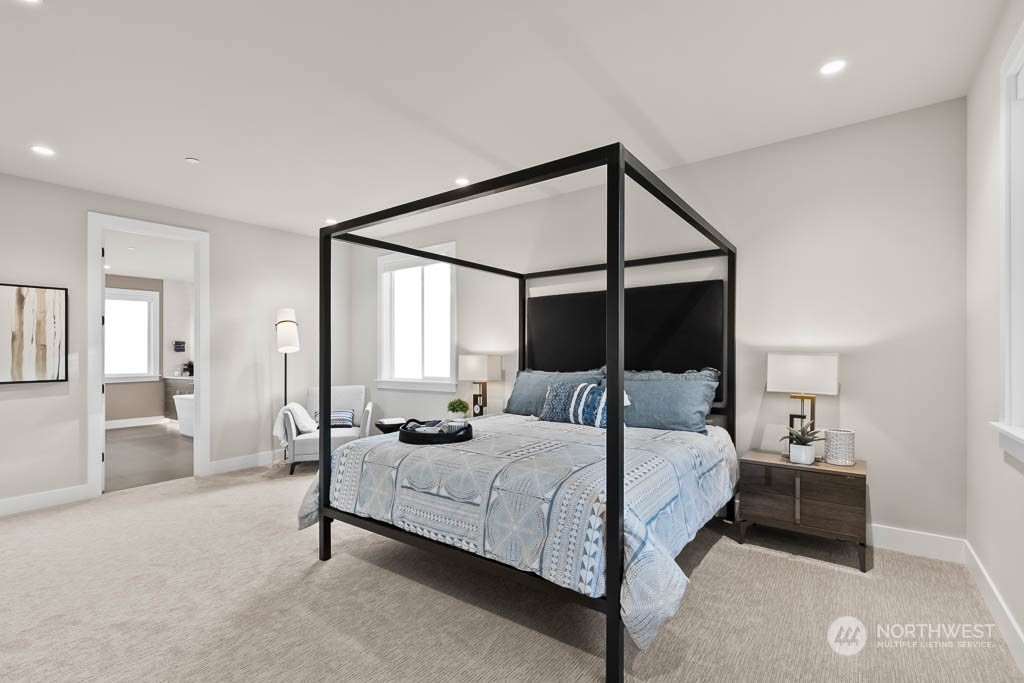 933 131st Place Northeast, Unit 4 Bellevue, WA 98005 - Photo 17 of 18 a bedroom with a bed and a night stand