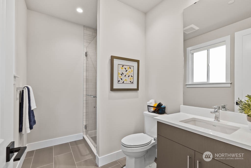 933 131st Place Northeast, Unit 4 Bellevue, WA 98005 - Photo 10 of 18 a bathroom with a sink and a toilet