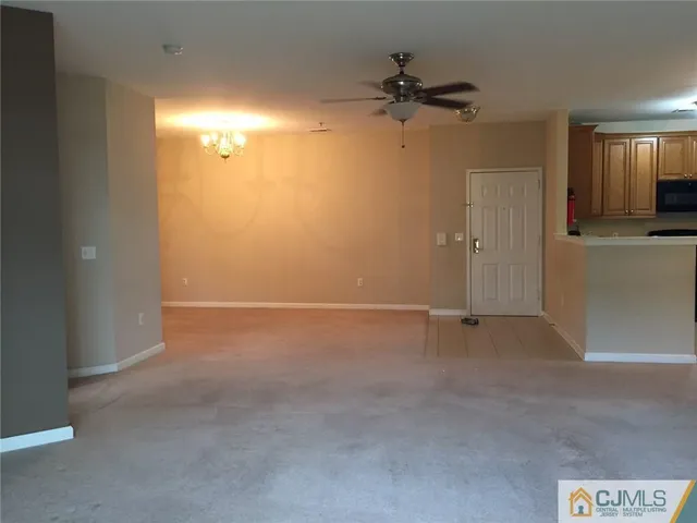 a view of a room with a walk in closet and a bathroom