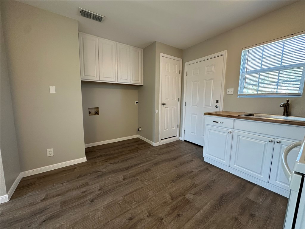 3152 Meadow Lane Robstown, TX 78380 - Photo 11 of 40 a view of a kitchen with wooden floor and electronic appliances