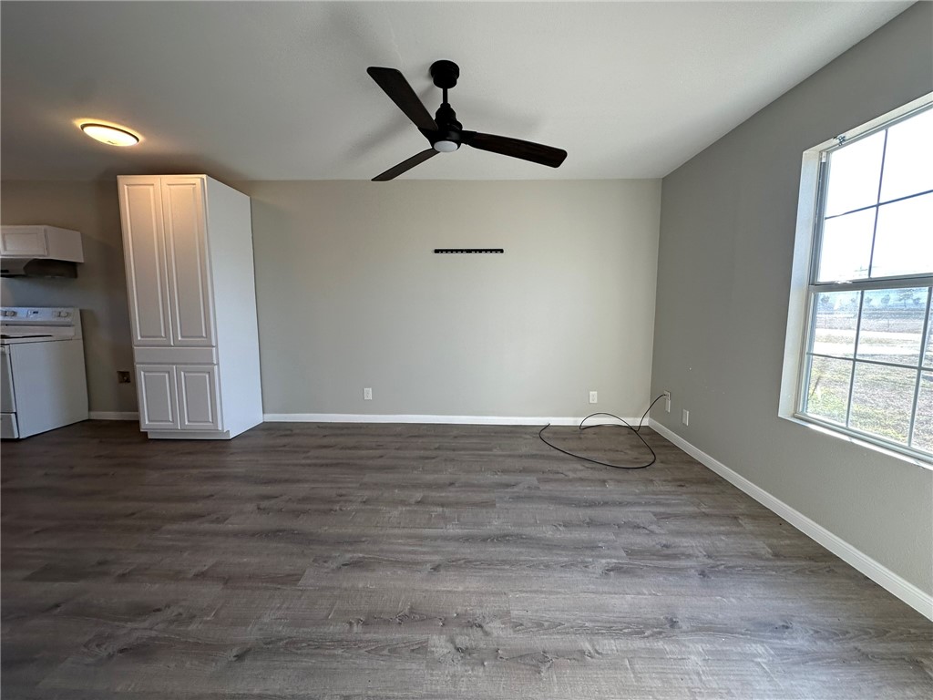 3152 Meadow Lane Robstown, TX 78380 - Photo 2 of 40 a view of empty room with wooden floor and window