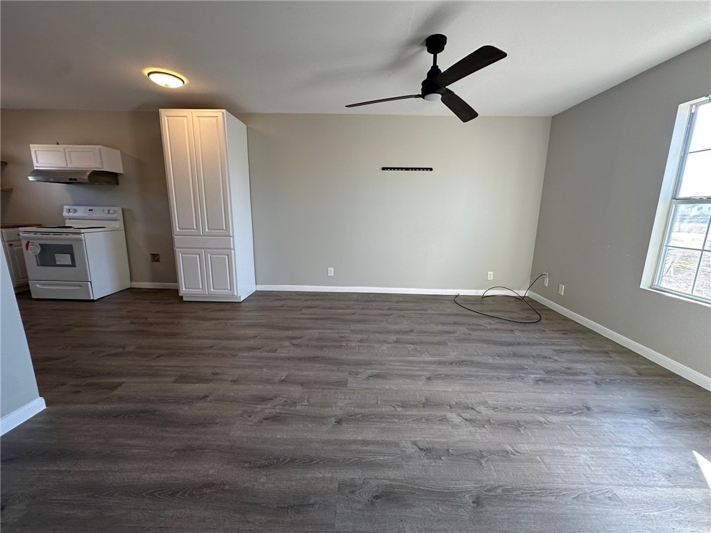 3152 Meadow Lane Robstown, TX 78380 - Photo 4 of 40 a view of empty room with wooden floor and window