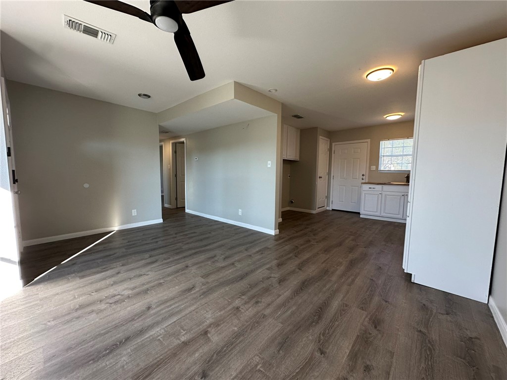 3152 Meadow Lane Robstown, TX 78380 - Photo 6 of 40 a view of an empty room and wooden floor