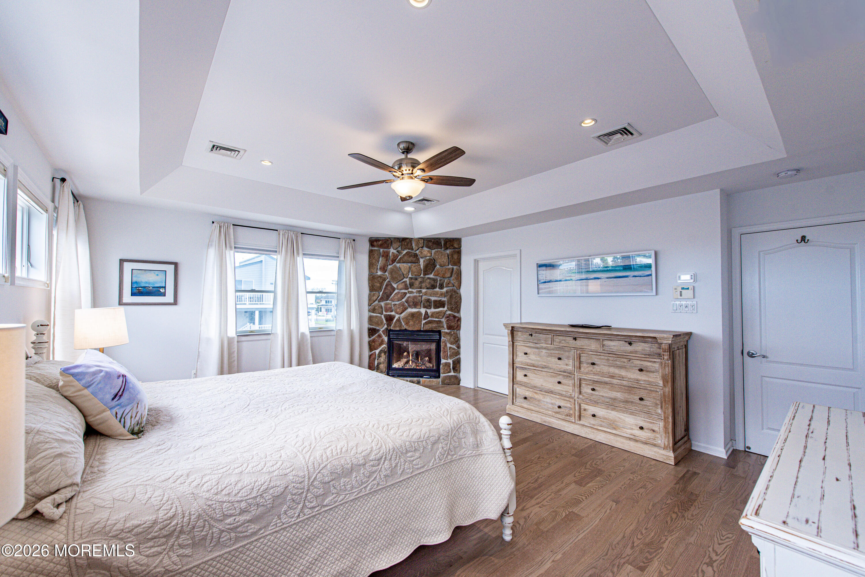 5 A Sunset Boulevard Barnegat Light, NJ 08006 - Photo 20 of 65 a spacious bedroom with a bed and a dresser