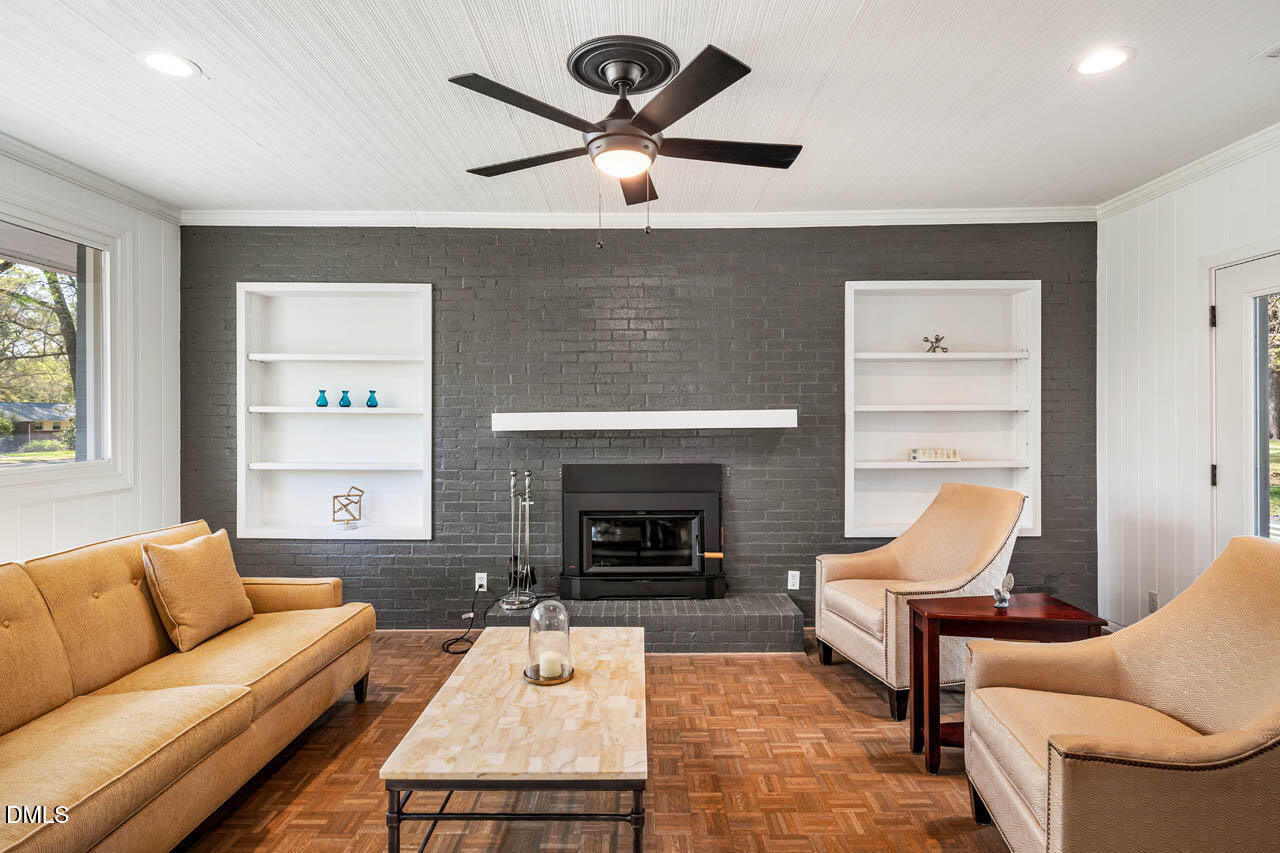 231 Flemington Road Chapel Hill, NC 27517 - Photo 13 of 48 a living room with furniture and a fireplace