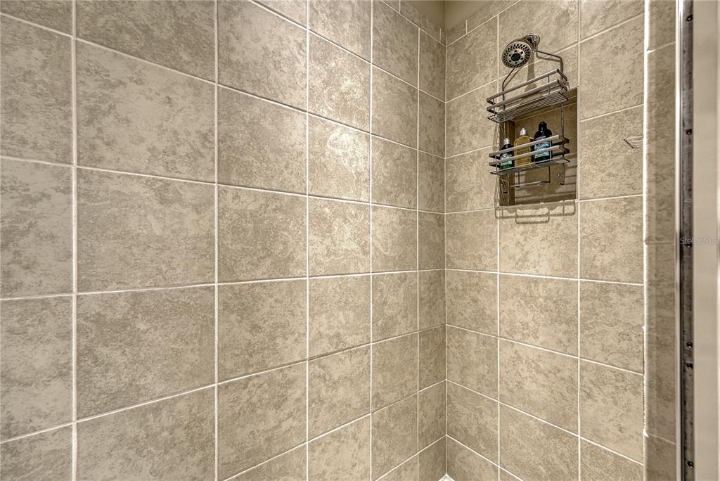 5420 Cicerone Street, Unit 101 Sarasota, FL 34238 - Photo 18 of 40 a bathroom with a shower