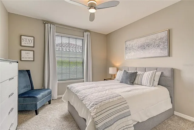 a bedroom with a bed and a couch