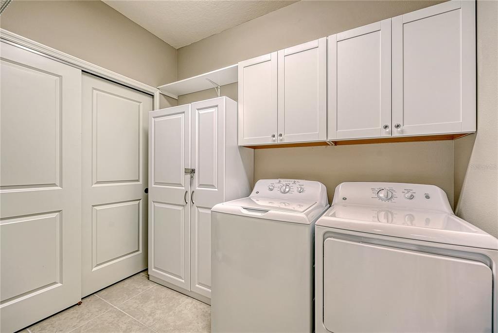 5420 Cicerone Street, Unit 101 Sarasota, FL 34238 - Photo 23 of 40 a utility room with dryer and washer