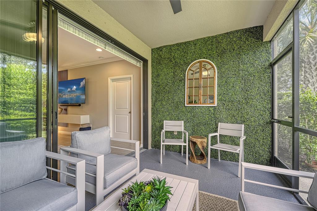 5420 Cicerone Street, Unit 101 Sarasota, FL 34238 - Photo 25 of 40 a view of a chairs and table in a balcony