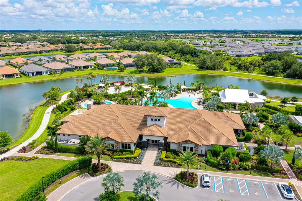 5420 Cicerone Street, Unit 101 Sarasota, FL 34238 - Photo 28 of 40 an aerial view of residential houses with outdoor space and lake view