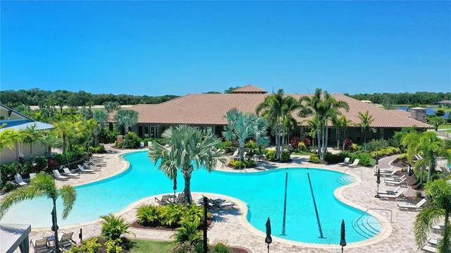 a view of a house with garden space and a patio