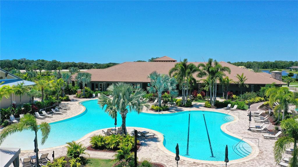 5420 Cicerone Street, Unit 101 Sarasota, FL 34238 - Photo 31 of 40 a view of a house with garden space and a patio