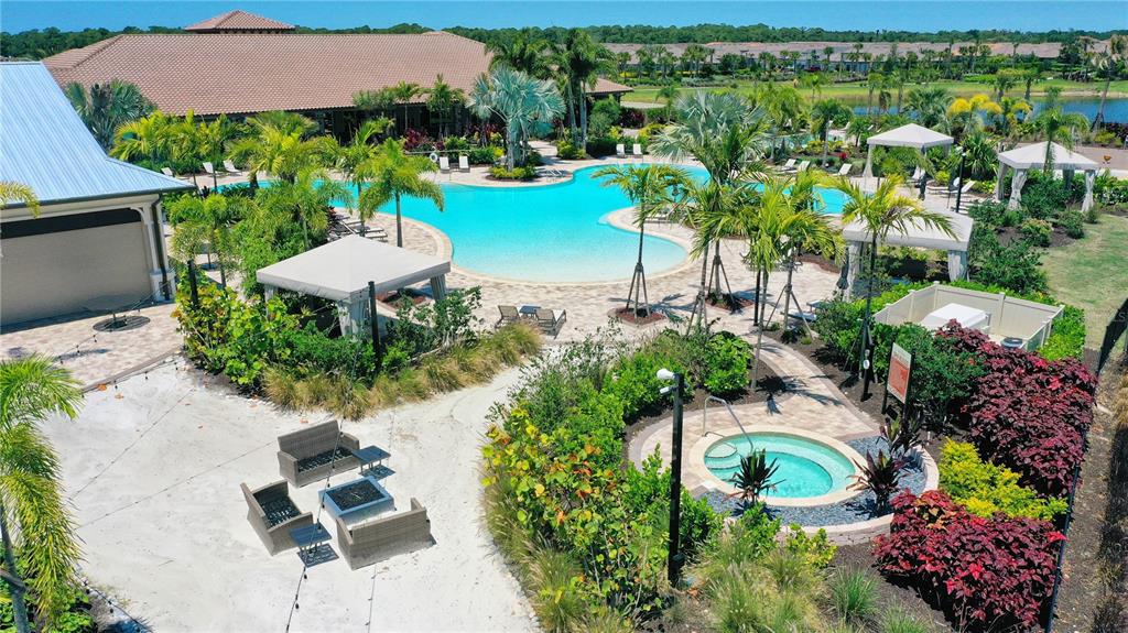 5420 Cicerone Street, Unit 101 Sarasota, FL 34238 - Photo 33 of 40 a view of a table and chairs in patio