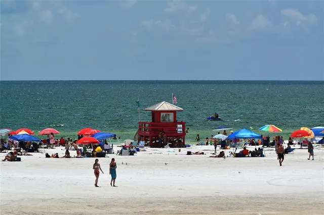 a view of a patio with table and chairs and potted plants