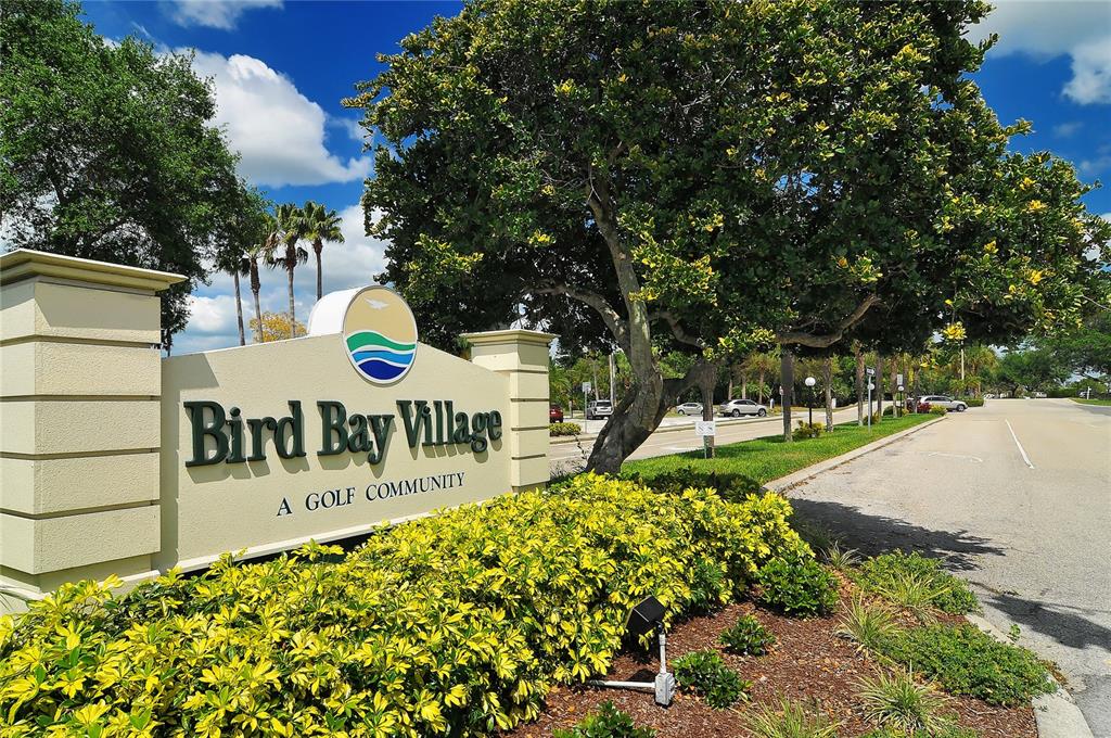 5420 Cicerone Street, Unit 101 Sarasota, FL 34238 - Photo 37 of 40 a view of a patio with table and chairs and potted plants