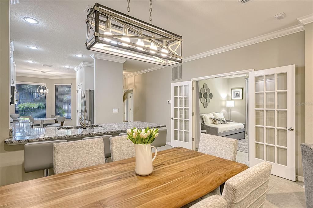 5420 Cicerone Street, Unit 101 Sarasota, FL 34238 - Photo 6 of 40 a view of a dining room and livingroom with furniture