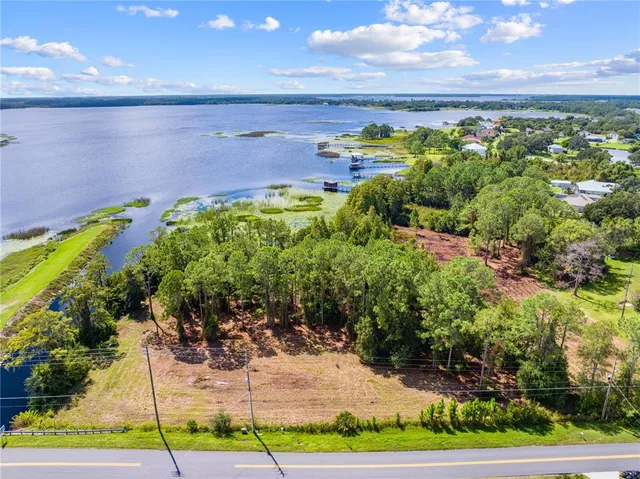 a view of a yard with an outdoor seating