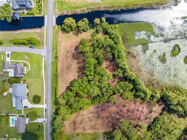 a view of a lake with a building in the background