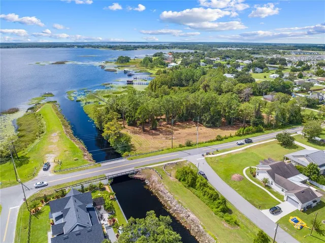 a view of a swimming pool with an outdoor seating