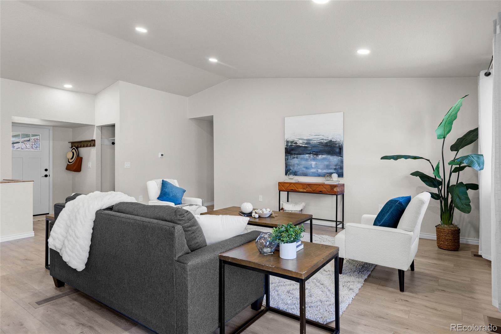 8205 Dudley Way Arvada, CO 80005 - Photo 12 of 44 a living room with furniture and a potted plant
