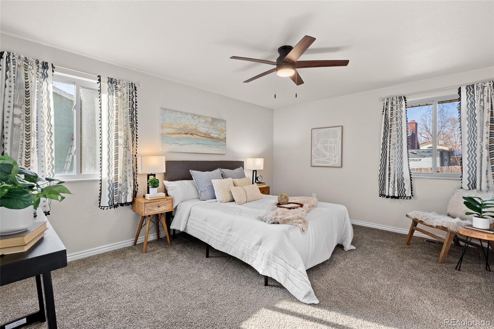 8205 Dudley Way Arvada, CO 80005 - Photo 14 of 44 a bedroom with a bed and a window