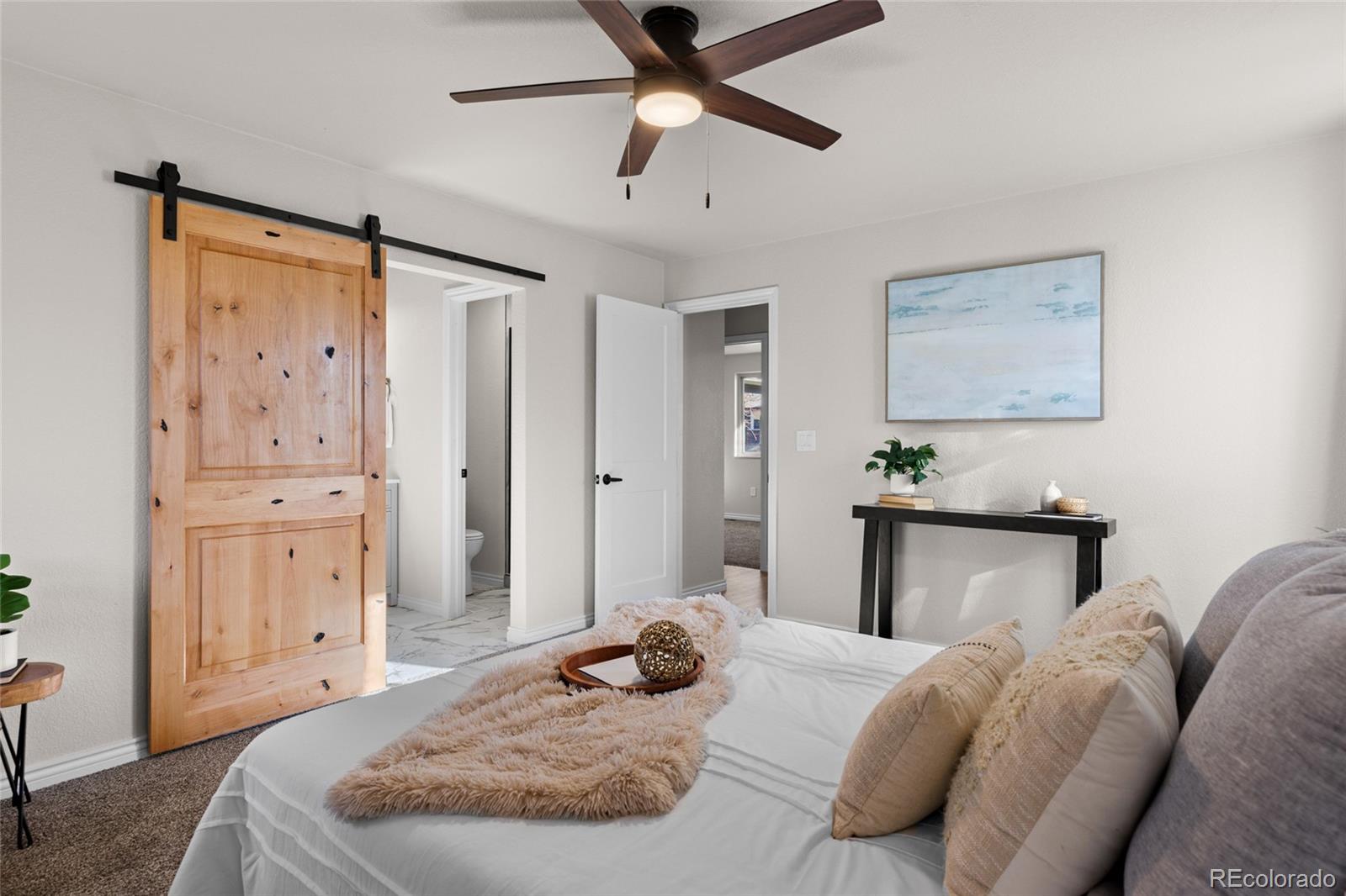 8205 Dudley Way Arvada, CO 80005 - Photo 15 of 44 a bedroom with a bed and cabinets