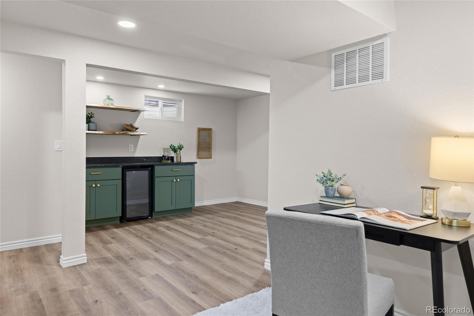 8205 Dudley Way Arvada, CO 80005 - Photo 24 of 44 a kitchen with a sink cabinets and appliances