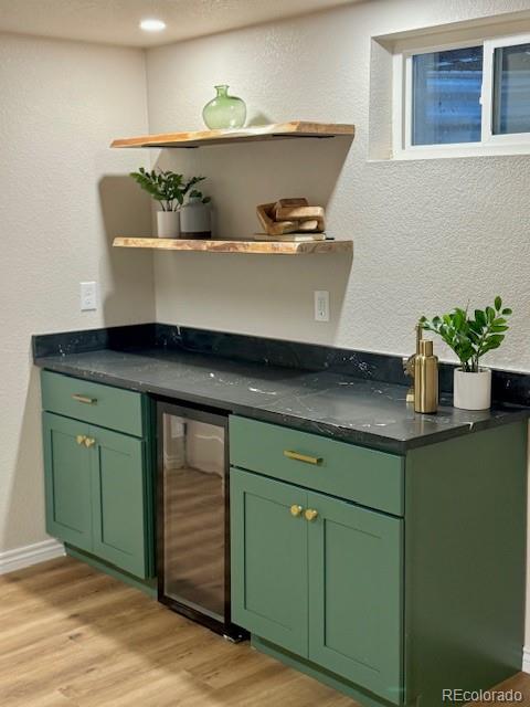 8205 Dudley Way Arvada, CO 80005 - Photo 25 of 44 a view of cabinets with a sink and wooden floor