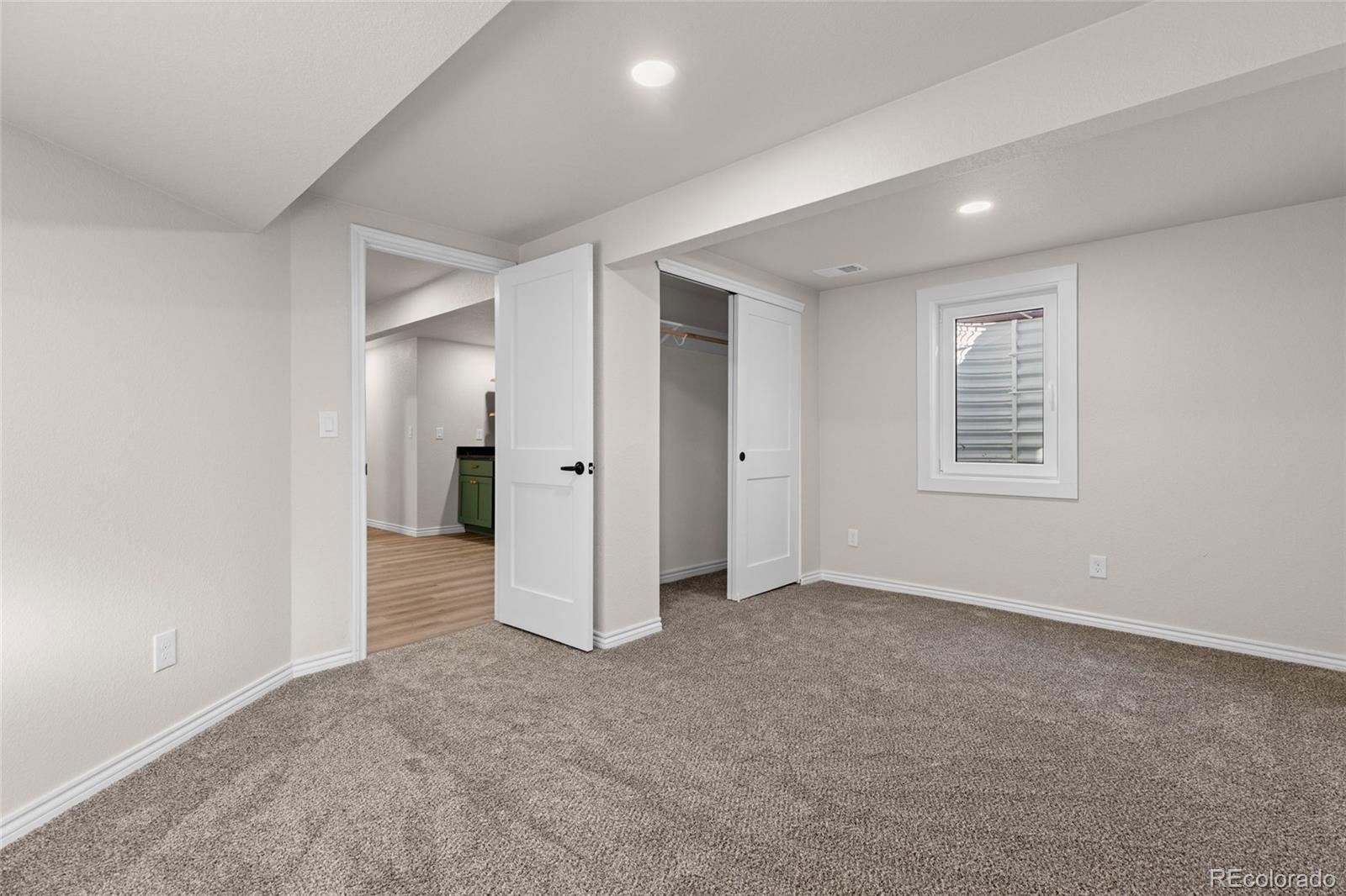 8205 Dudley Way Arvada, CO 80005 - Photo 26 of 44 an empty room with windows and closet