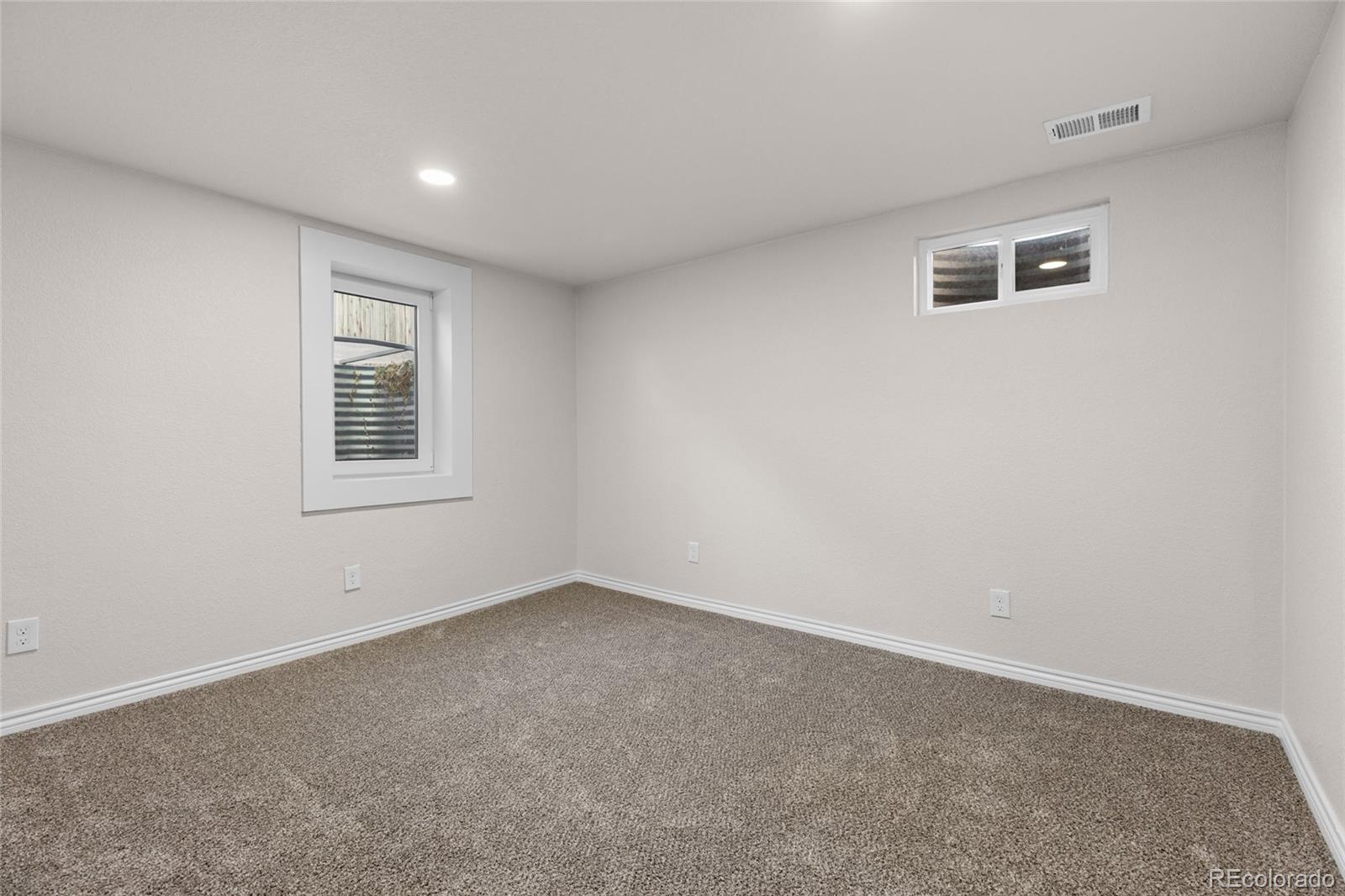 8205 Dudley Way Arvada, CO 80005 - Photo 27 of 44 a view of an empty room with a window