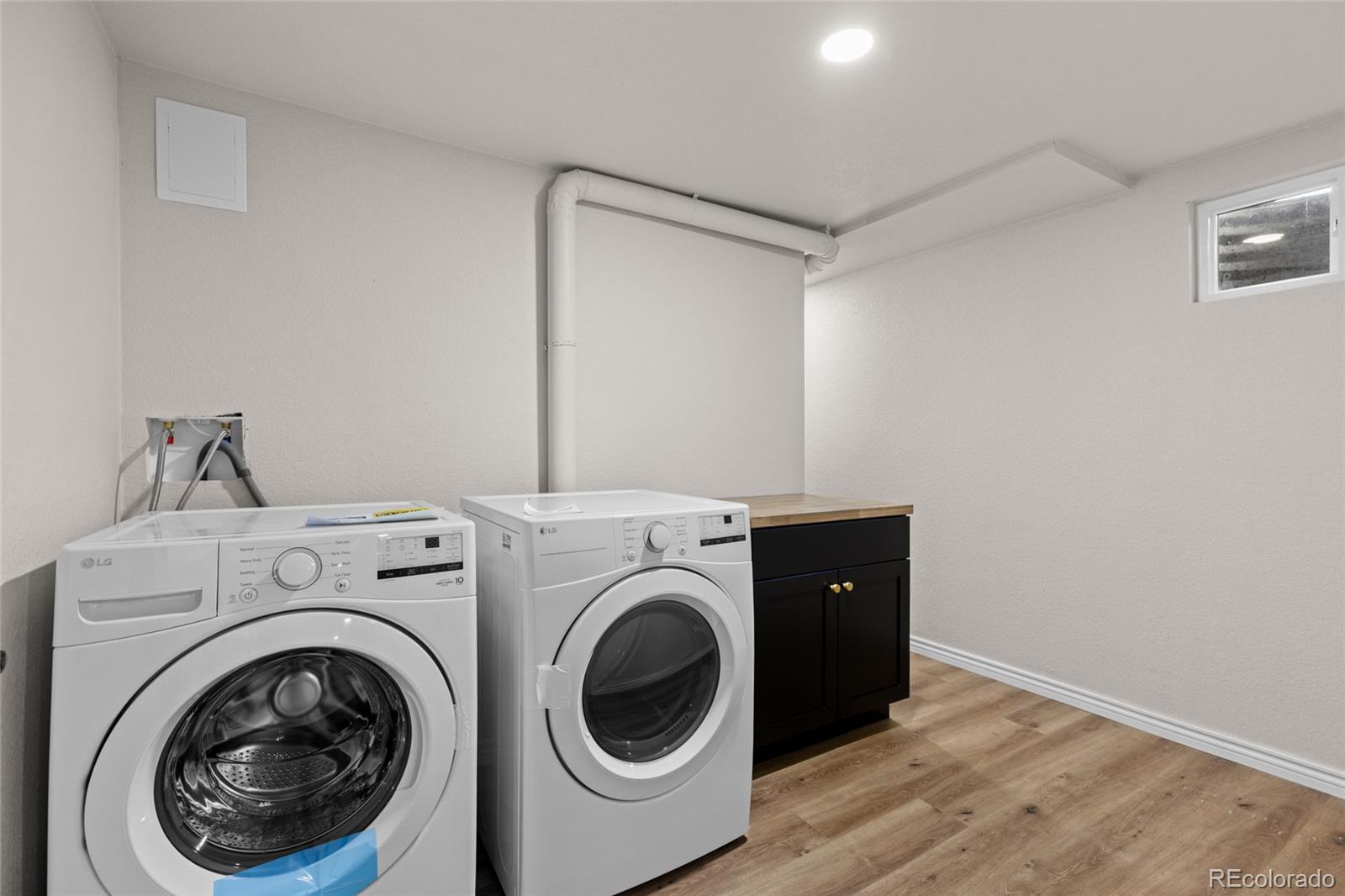 8205 Dudley Way Arvada, CO 80005 - Photo 29 of 44 a utility room with dryer and washer