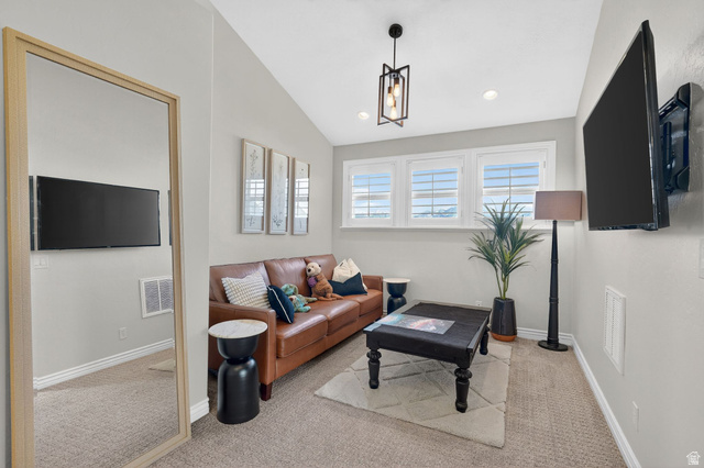 14738 Tangle Hill Road Herriman, UT 84096 - Photo 34 of 66 Room featuring vaulted ceilings, recessed lighting, and a wall-mounted television