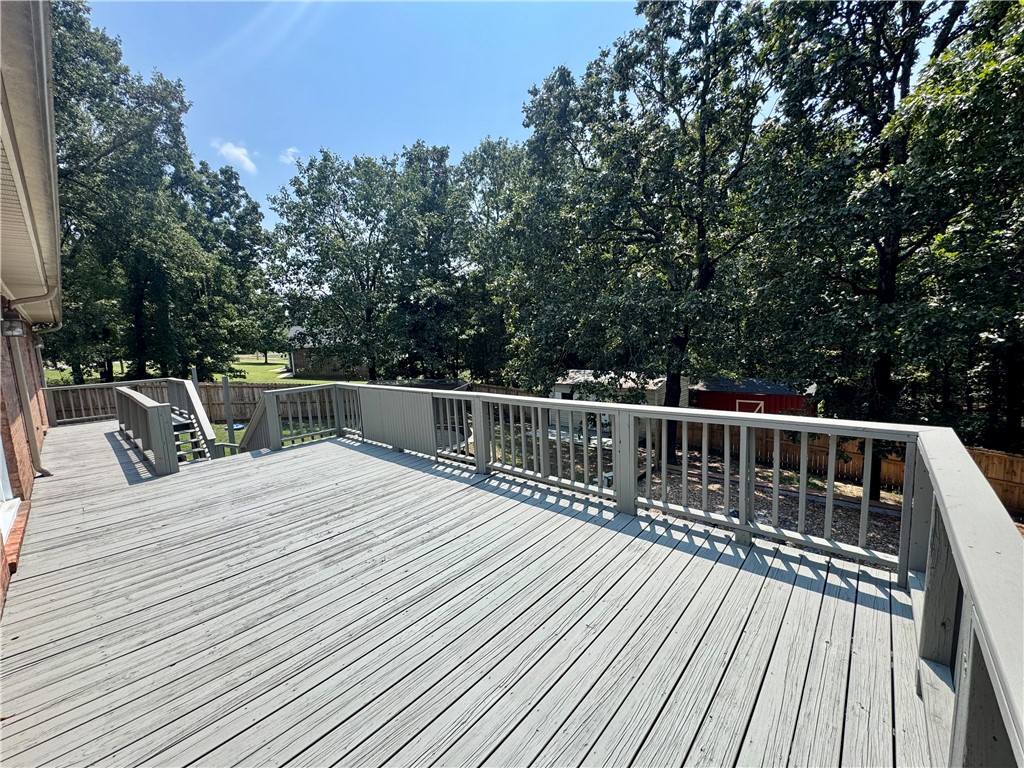 1197 Ridgeview Lane Russellville, AR 72802 - Photo 33 of 44 Expansive wood deck with a painted finish, featuring a full railing system and integrated steps