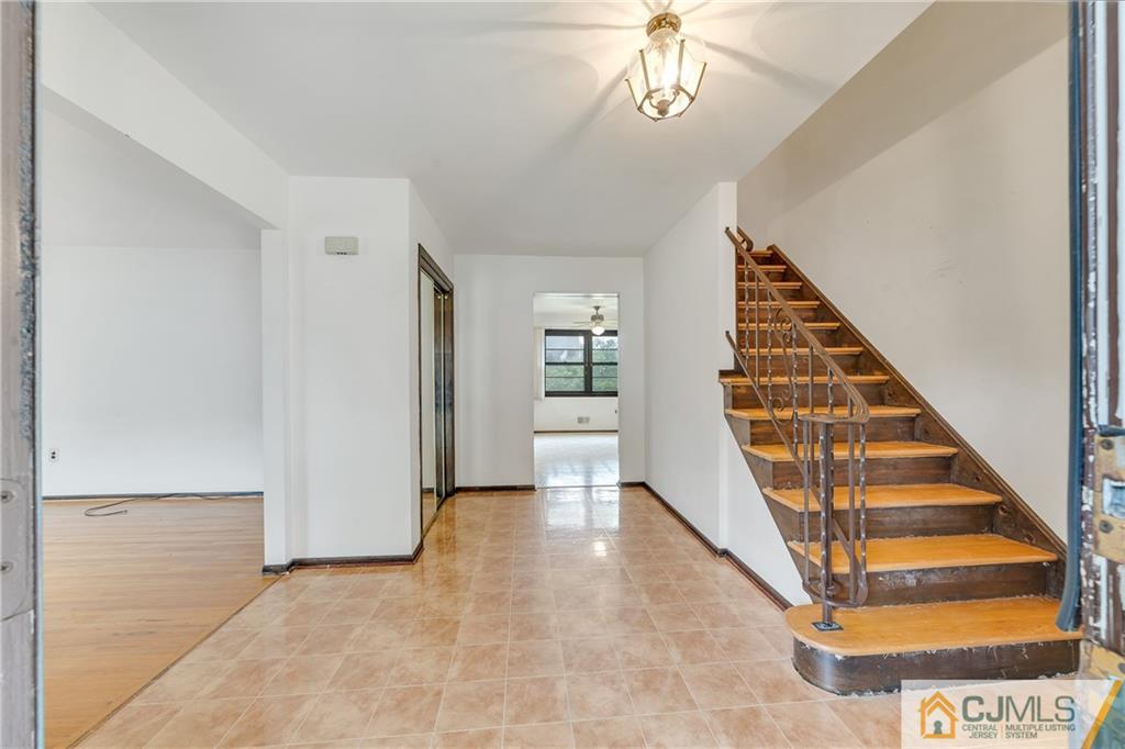 65 Dellwood Road Edison, NJ 08820 - Photo 2 of 24 en view interior of a house with wooden floor and stairs