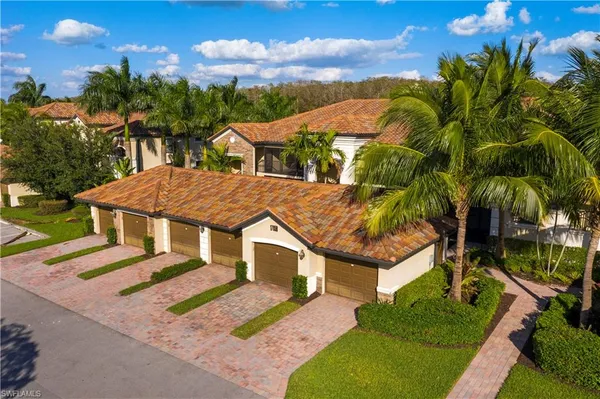 a aerial view of a house with a yard