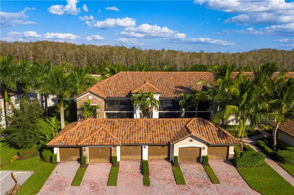 an aerial view of a house with balcony wooden floor and outdoor space