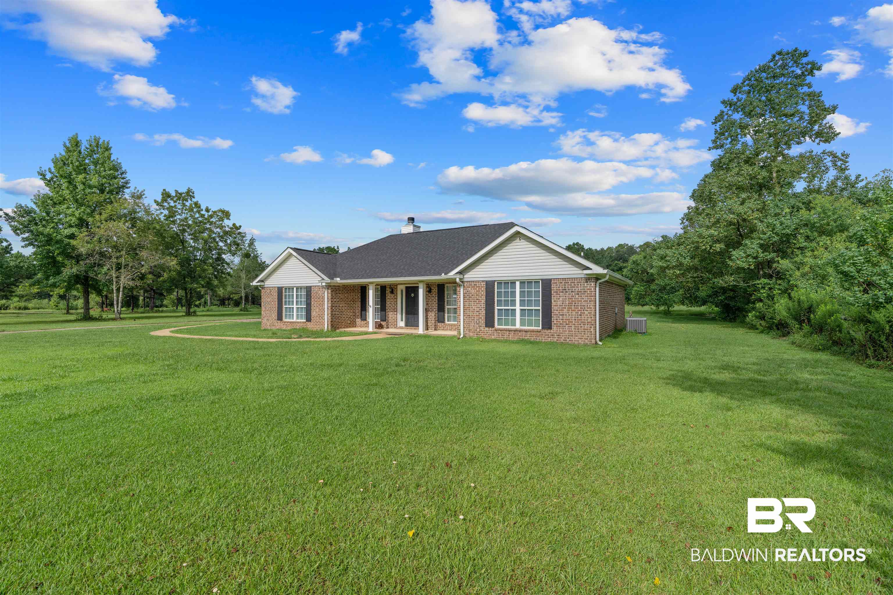 34711 Pond Road Stapleton, AL 36578 - Photo 6 of 38 Ranch-style house featuring brick siding, a front yard, and a chimney