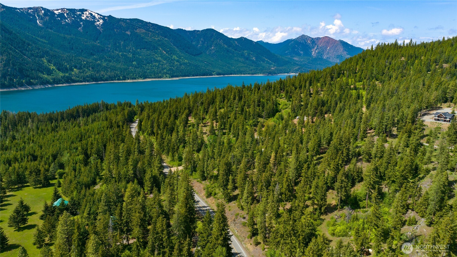 11 Salmon La Sac Road Ronald, WA 98940 - Photo 5 of 8 a view of a lush green hillside and a houses
