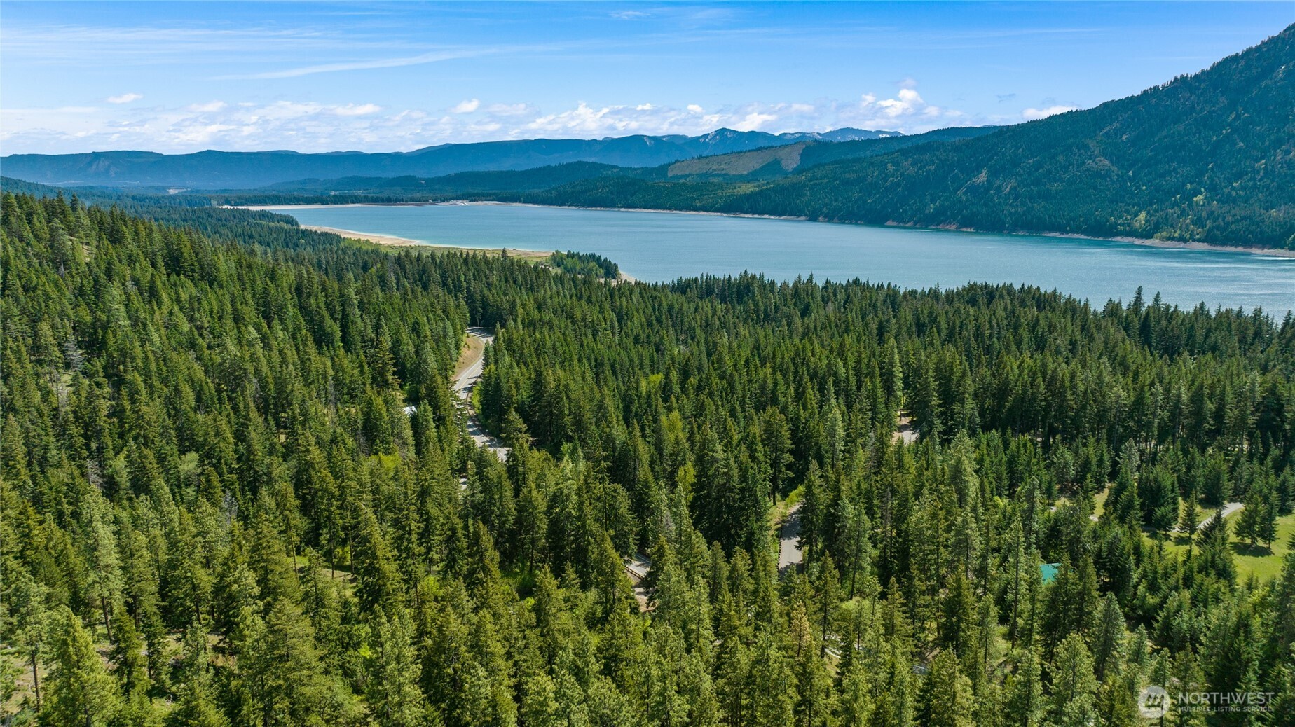 11 Salmon La Sac Road Ronald, WA 98940 - Photo 7 of 8 a view of a lush green outdoor space with a lake view