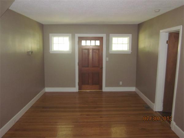 21 Arcadia Road Billerica, MA 01821 - Photo 4 of 10 an empty room with wooden floor and windows