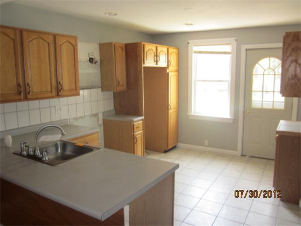 21 Arcadia Road Billerica, MA 01821 - Photo 5 of 10 a kitchen with a refrigerator and a sink