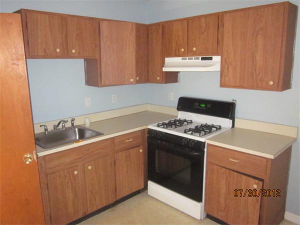21 Arcadia Road Billerica, MA 01821 - Photo 10 of 10 a kitchen with a stove and a sink