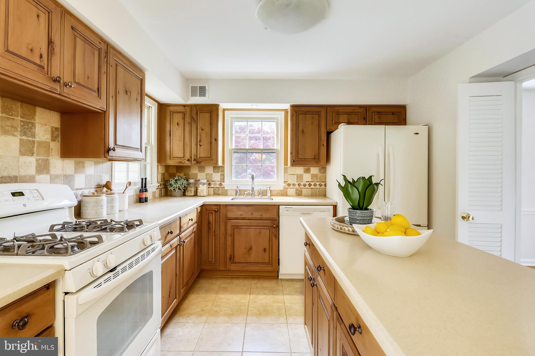 13624 Middlevale Lane Silver Spring, MD 20906 - Photo 22 of 60 Kitchen with Island & Corian Counters