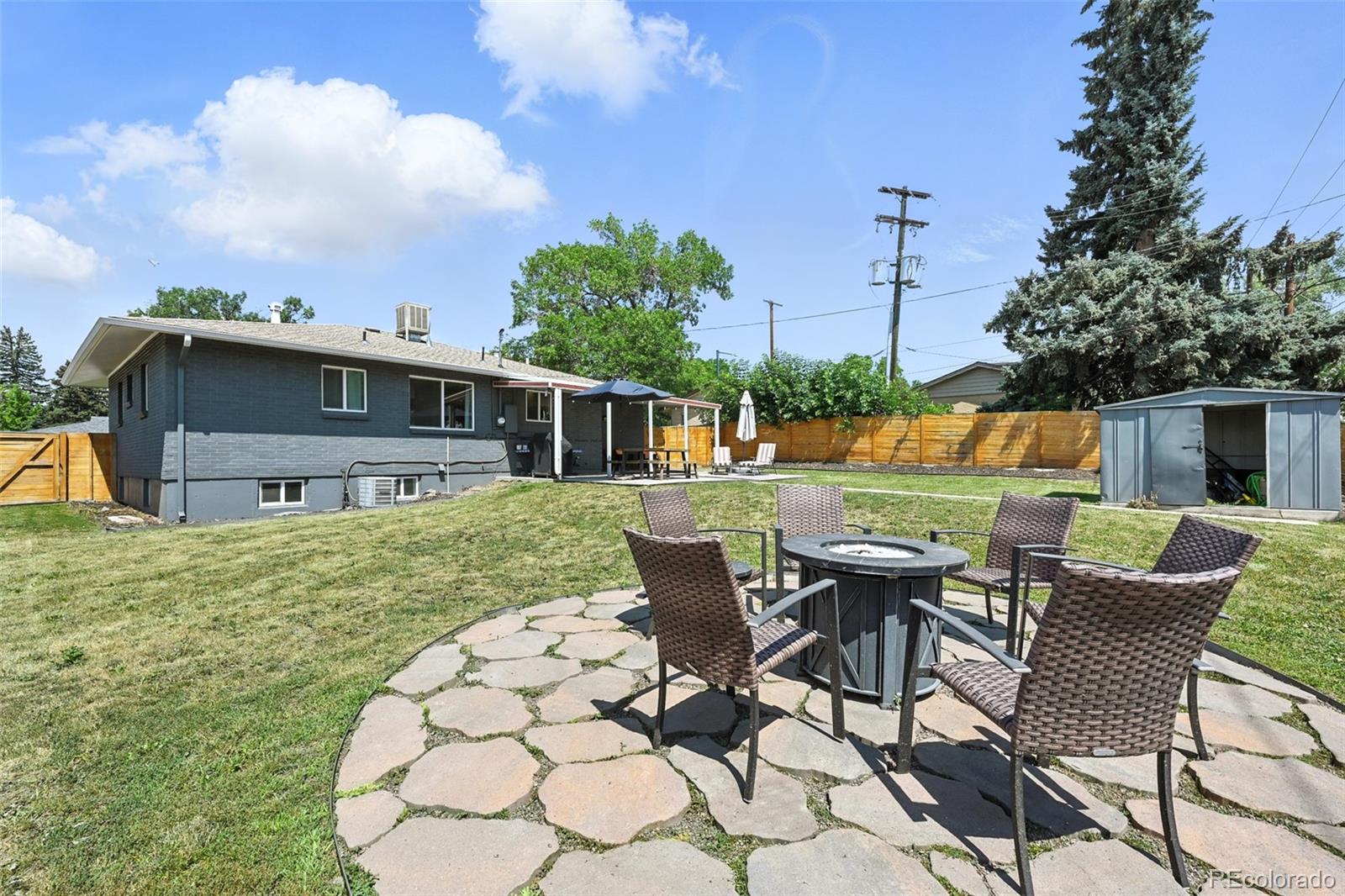 2714 South Raleigh Street Denver, CO 80236 - Photo 32 of 34 an outdoor space with furniture and garden