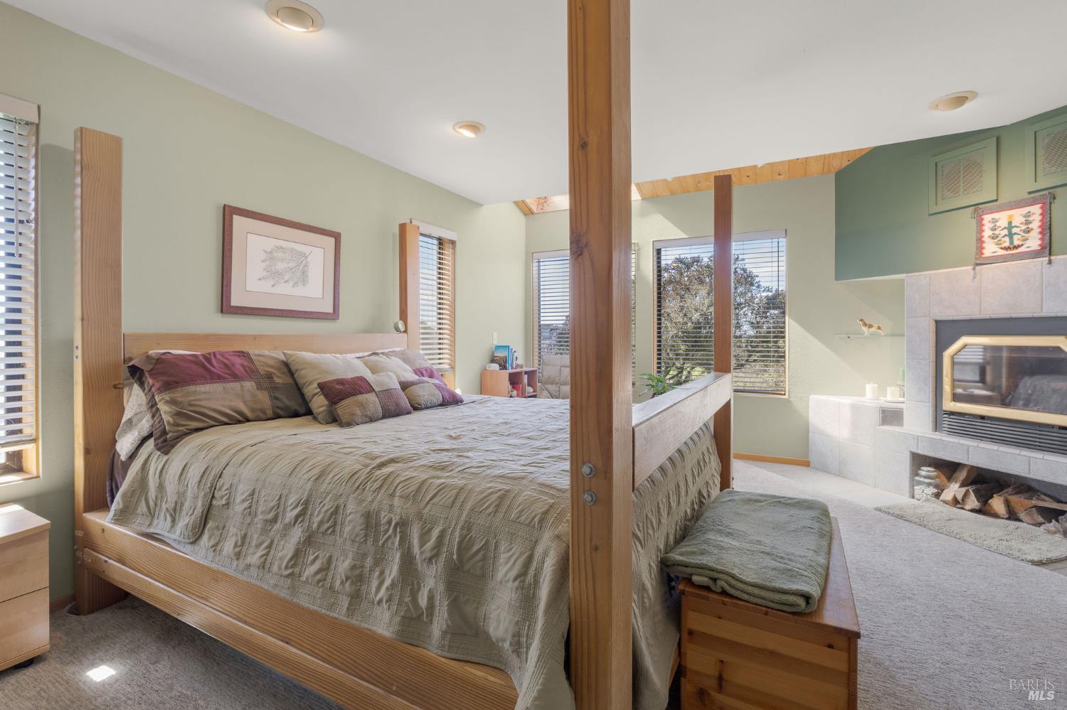 39574 Leeward Road The Sea Ranch, CA 95497 - Photo 31 of 72 a spacious bedroom with a bed and a couch