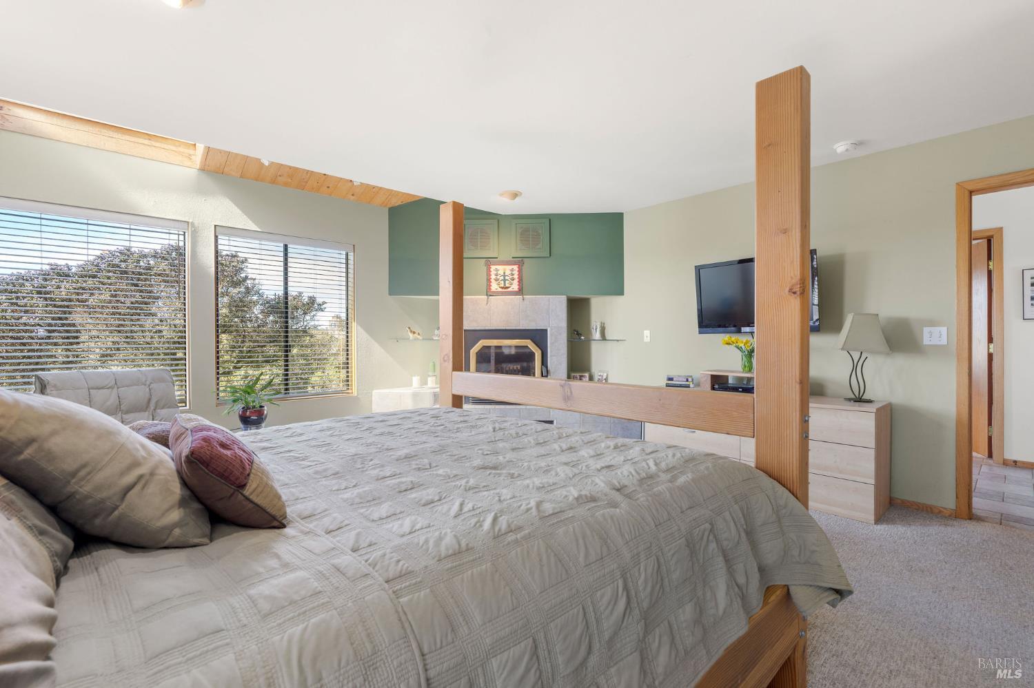39574 Leeward Road The Sea Ranch, CA 95497 - Photo 33 of 72 a bed room with a bed and a large window