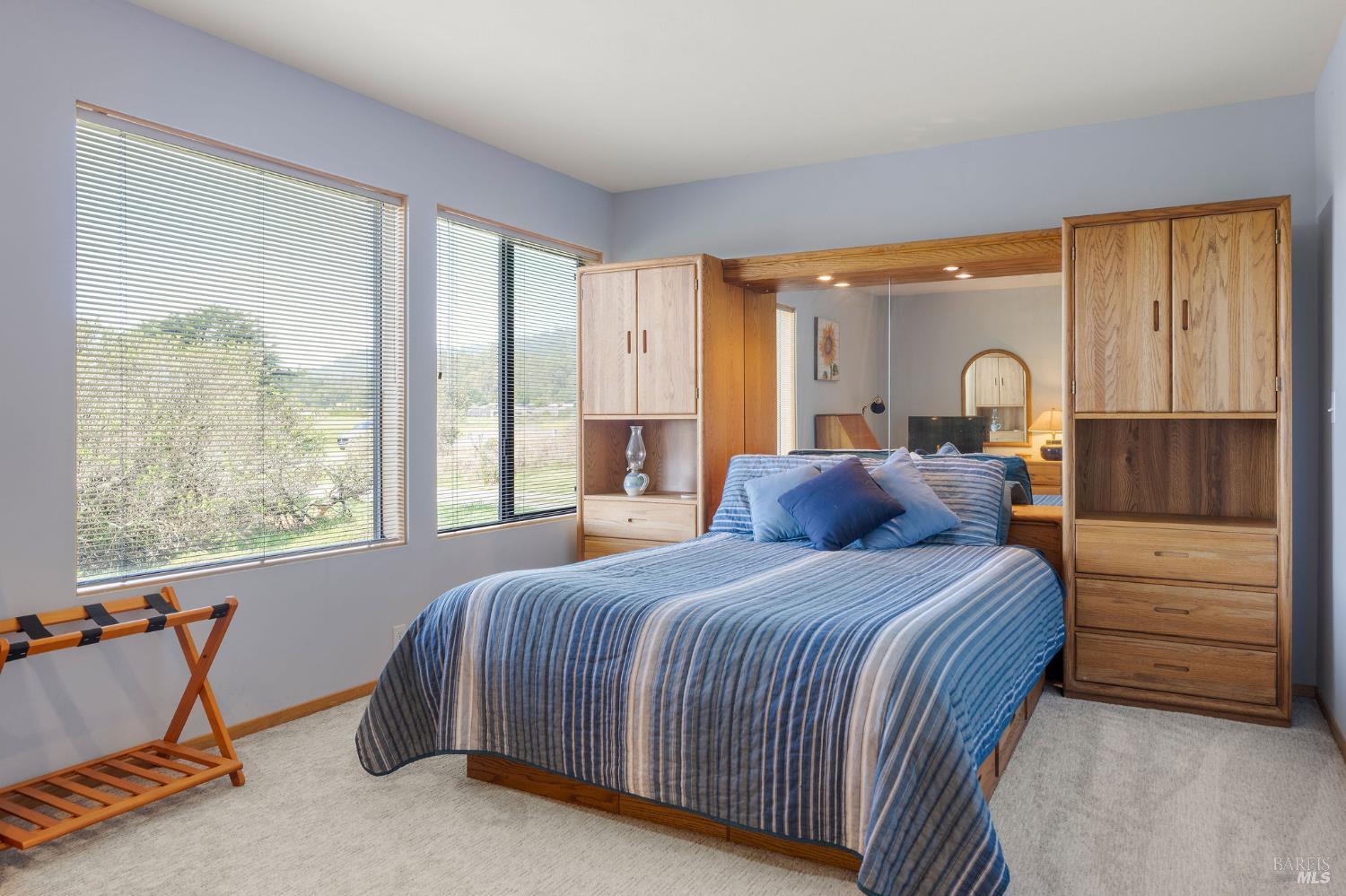 39574 Leeward Road The Sea Ranch, CA 95497 - Photo 37 of 72 a bedroom with a bed and a large window
