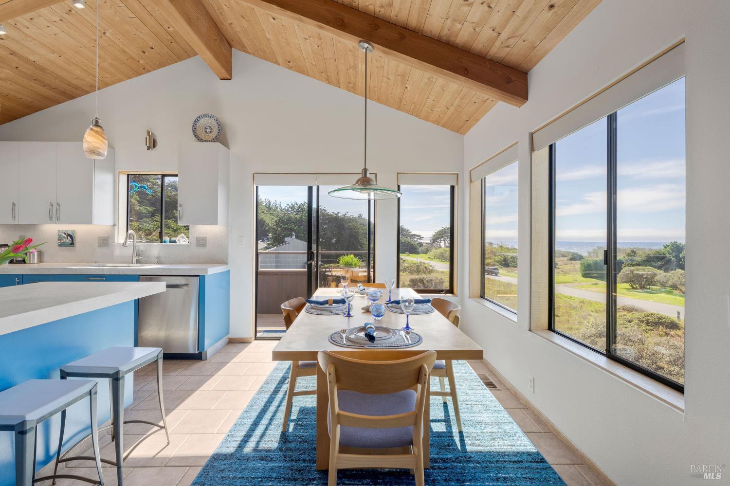 39574 Leeward Road The Sea Ranch, CA 95497 - Photo 4 of 72 a dining room with furniture a chandelier and wooden floor
