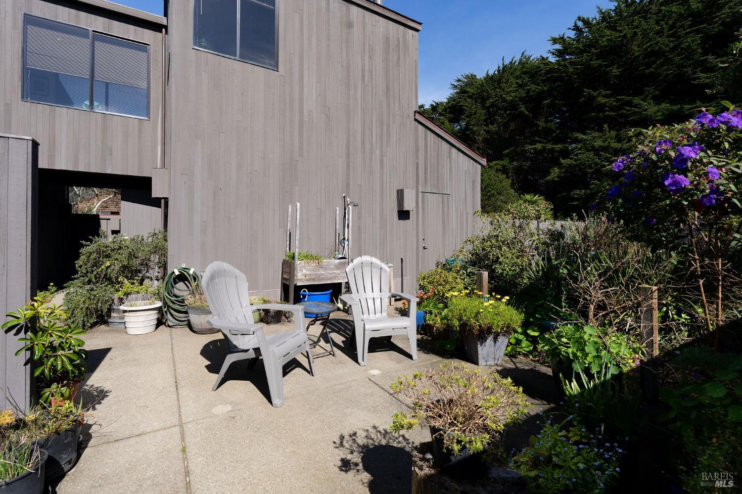 39574 Leeward Road The Sea Ranch, CA 95497 - Photo 45 of 72 a view of a patio with table and chairs and potted plants
